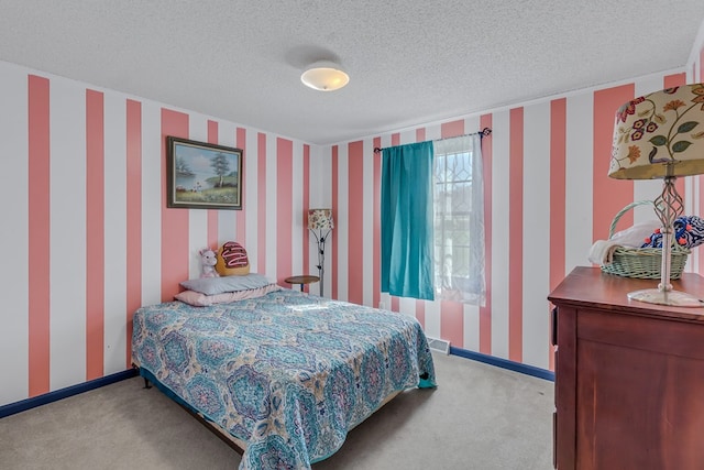 carpeted bedroom with a textured ceiling