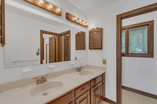 1061 Twiggs Ferry Rd, Hartfield, VA 23071 - full bathroom featuring double vanity and baseboards