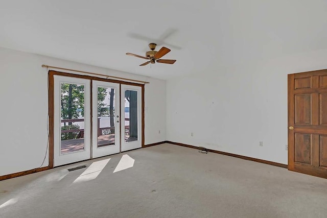1061 Twiggs Ferry Rd, Hartfield, VA 23071 - carpeted empty room with french doors and ceiling fan