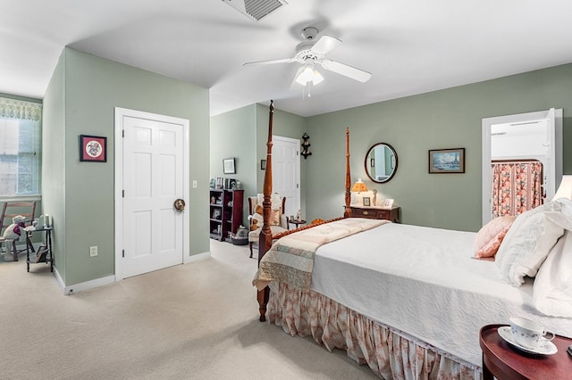 carpeted bedroom with ceiling fan, visible vents, and baseboards