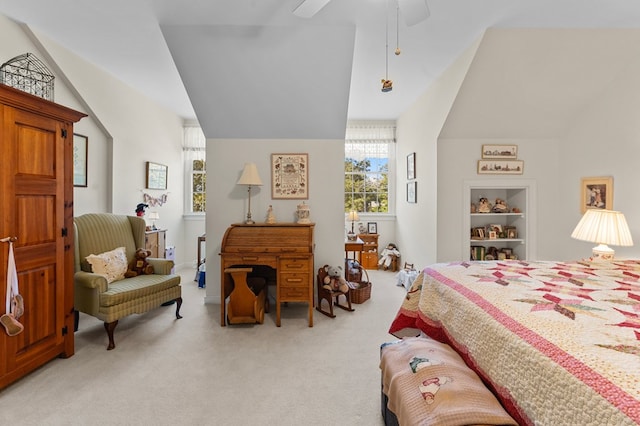 bedroom with light colored carpet, vaulted ceiling, and ceiling fan