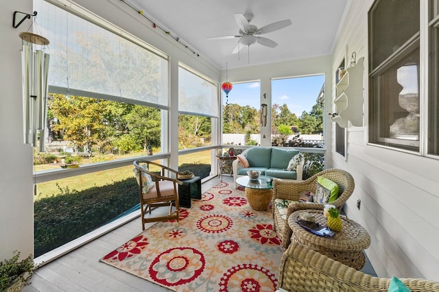 sunroom with ceiling fan