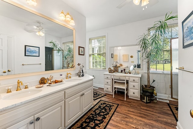 bathroom featuring hardwood / wood-style floors, vanity, ceiling fan, and a wealth of natural light