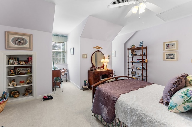 carpeted bedroom featuring visible vents, attic access, vaulted ceiling, ceiling fan, and baseboards