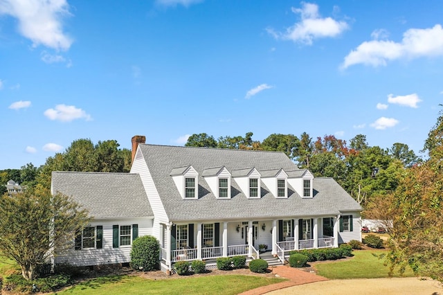 326 Coppedge Farm Rd, White Stone, VA 22578 - cape cod home with covered porch, a front yard, roof with shingles, and a chimney