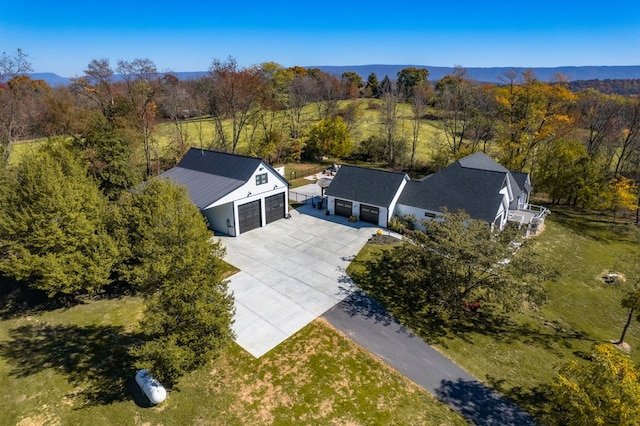 view from above of property featuring a heavily wooded area