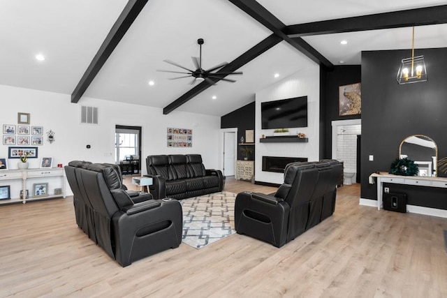 living room with beam ceiling, light hardwood / wood-style flooring, high vaulted ceiling, and ceiling fan