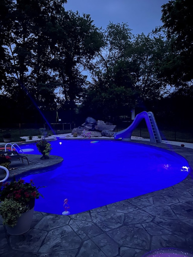 view of swimming pool featuring a water slide