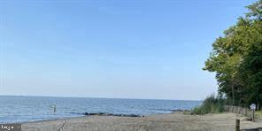 property view of water featuring a view of the beach