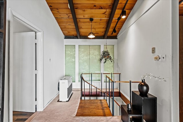 interior space with vaulted ceiling with beams and wood ceiling