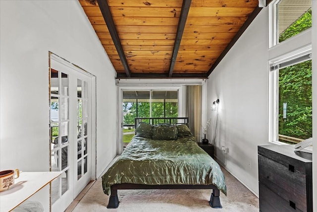 bedroom featuring french doors, vaulted ceiling with beams, light colored carpet, and wooden ceiling