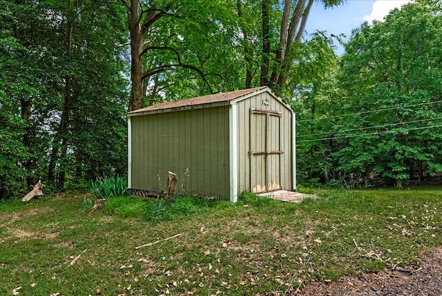 view of outdoor structure with a lawn