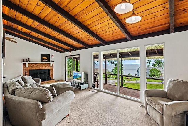 living room with vaulted ceiling with beams, carpet floors, ceiling fan, and wooden ceiling