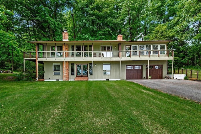 view of front of house with a front lawn and a garage