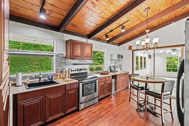 kitchen with appliances with stainless steel finishes, wood ceiling, sink, lofted ceiling with beams, and an inviting chandelier