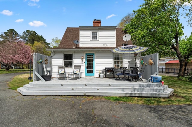 15498 Kings Hwy, Montross, VA 22520 - back of property with a wooden deck, a chimney, and outdoor dining space