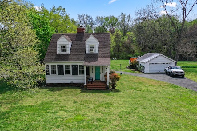 15498 Kings Hwy, Montross, VA 22520 - view of front of house featuring an outdoor structure, a garage, a chimney, a front lawn, and roof with shingles