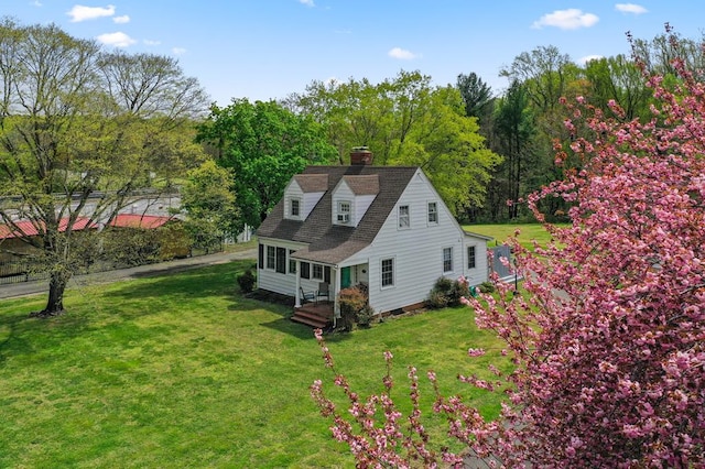 15498 Kings Hwy, Montross, VA 22520 - view of side of home featuring a chimney and a yard