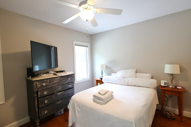 bedroom featuring ceiling fan and dark hardwood / wood-style flooring