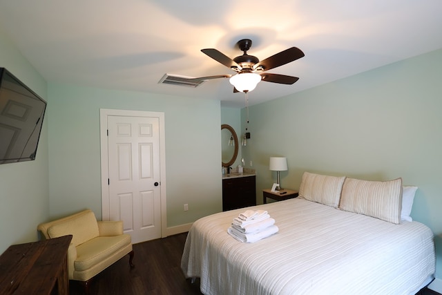 bedroom with ceiling fan and dark hardwood / wood-style floors