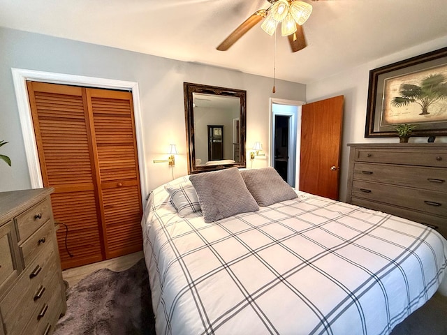 bedroom with ceiling fan and a closet