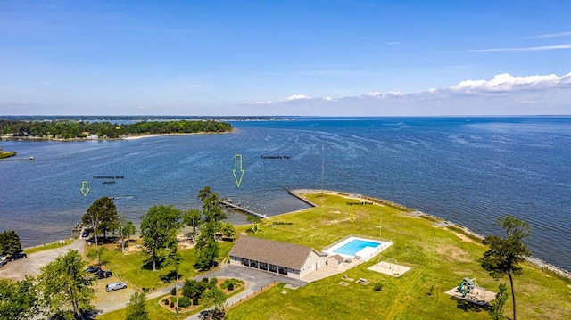 birds eye view of property with a water view