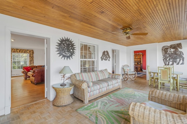 living room featuring light parquet flooring, ceiling fan, and wooden ceiling