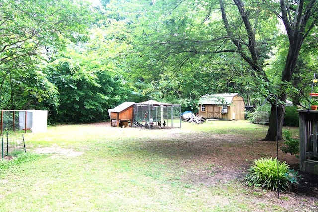436 W Point Rd, Lancaster, VA 22503 - view of yard with exterior structure and an outdoor structure