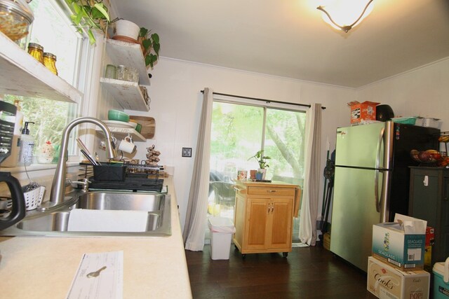 436 W Point Rd, Lancaster, VA 22503 - kitchen featuring freestanding refrigerator, dark wood finished floors, ornamental molding, and light countertops