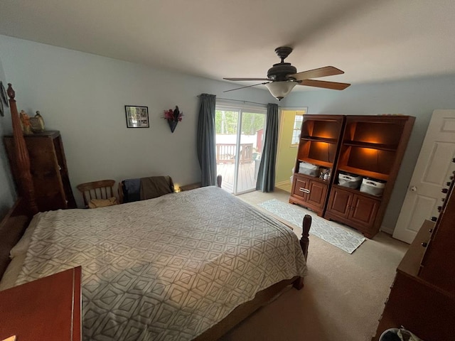 bedroom with light carpet, access to exterior, and a ceiling fan