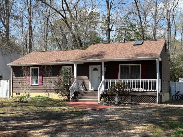ranch-style house featuring a porch and crawl space