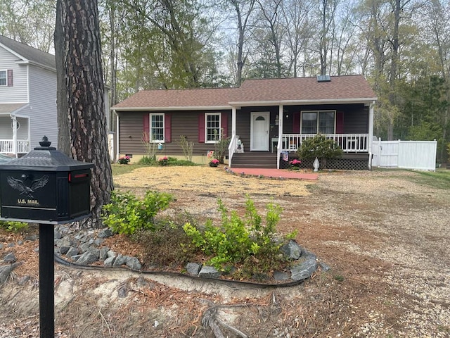 single story home with a porch