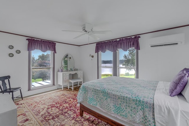 bedroom with ceiling fan, multiple windows, ornamental molding, and a wall mounted AC