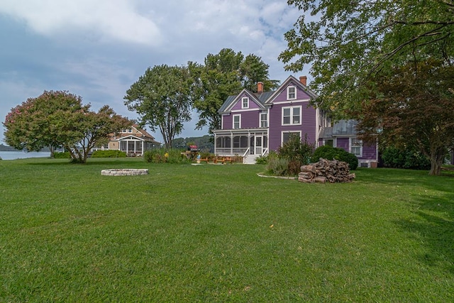 view of yard with a sunroom