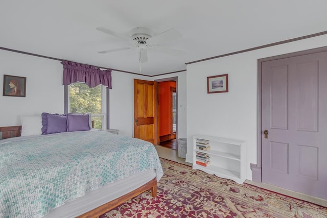 bedroom featuring a ceiling fan and crown molding