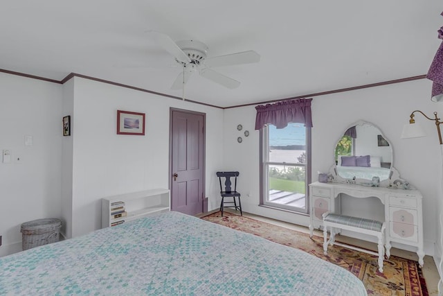 bedroom featuring ornamental molding and a ceiling fan