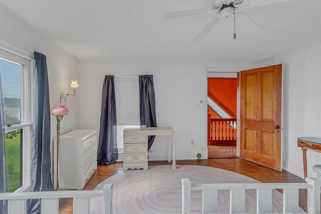 bedroom with wood finished floors and a ceiling fan