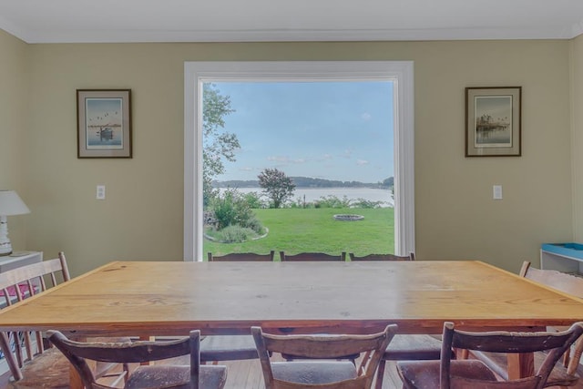 dining room with a water view