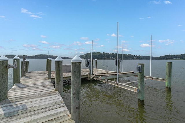 view of dock with a water view and boat lift