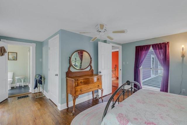 bedroom featuring hardwood / wood-style flooring, baseboards, visible vents, and a ceiling fan