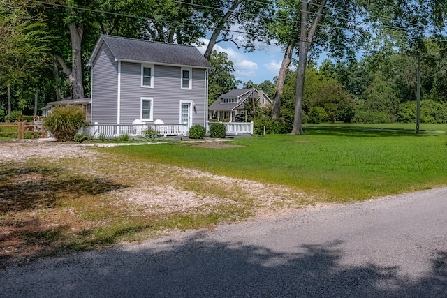 view of side of property with a lawn