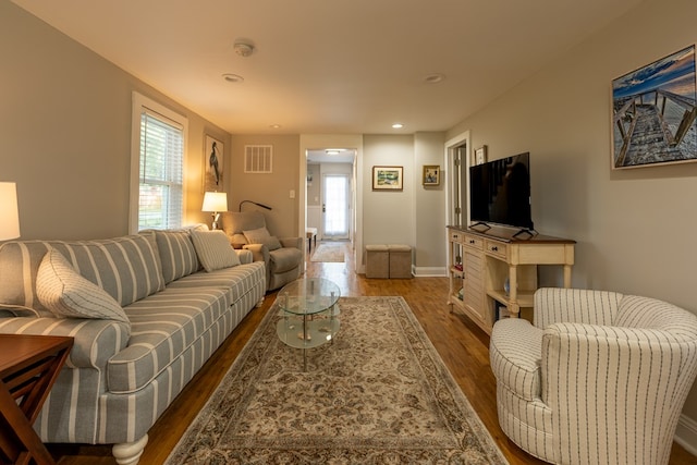 living room with dark wood-type flooring