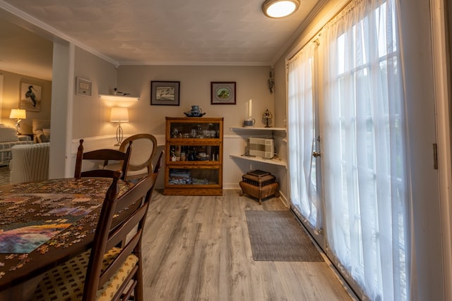 bedroom with hardwood / wood-style flooring and crown molding