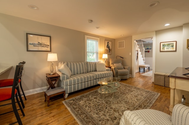 living room with light hardwood / wood-style flooring