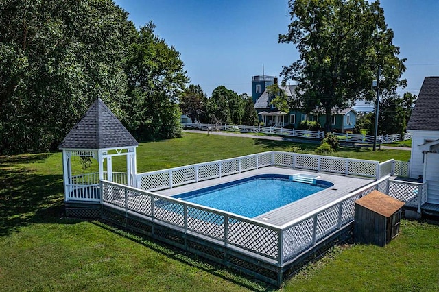 view of pool with a gazebo and a lawn