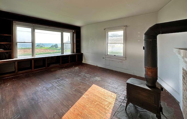 unfurnished living room with dark hardwood / wood-style flooring