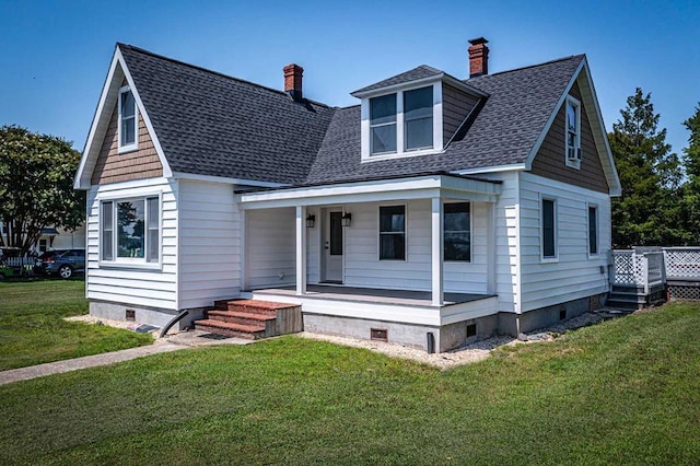 view of front of house with covered porch and a front yard