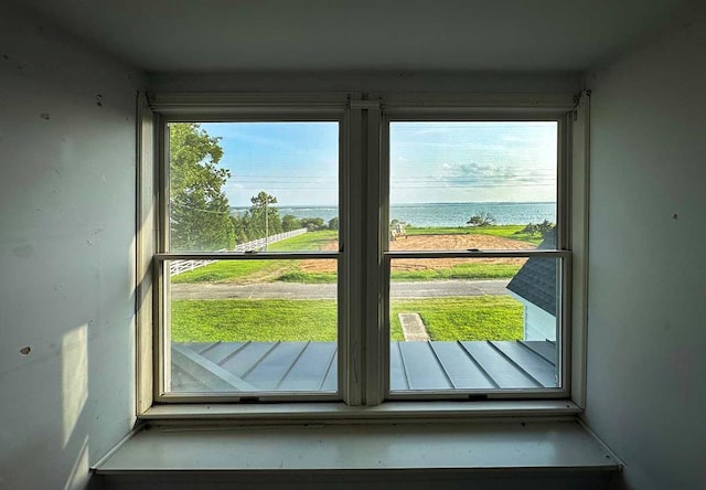 doorway to outside with a water view