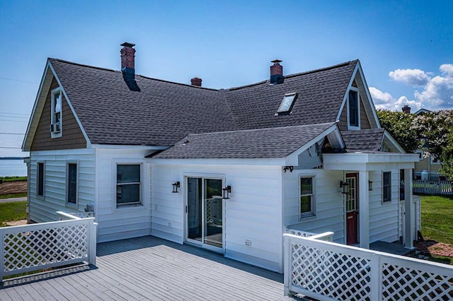 back of house featuring a wooden deck