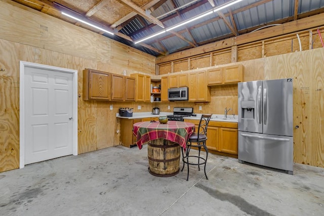 2920 Newmans Neck Rd, Heathsville, VA 22473 - kitchen with stainless steel appliances, concrete flooring, open shelves, and light countertops